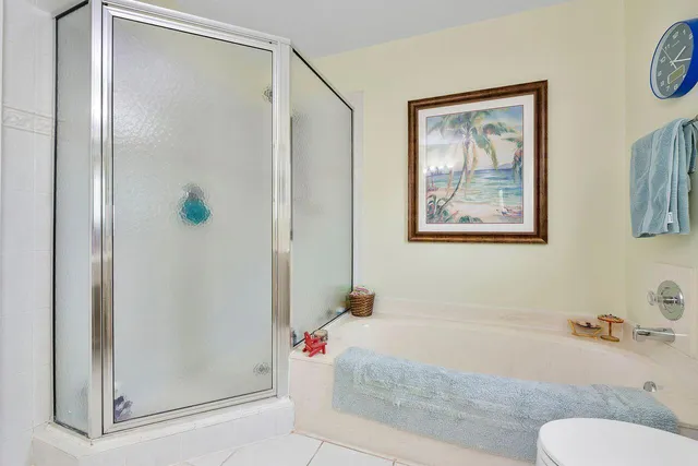 a bathroom with a tub and shower