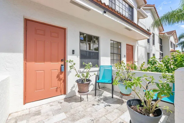 a view of a entryway with flower pots