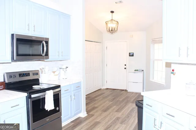 a view of a bathroom with a sink and a mirror