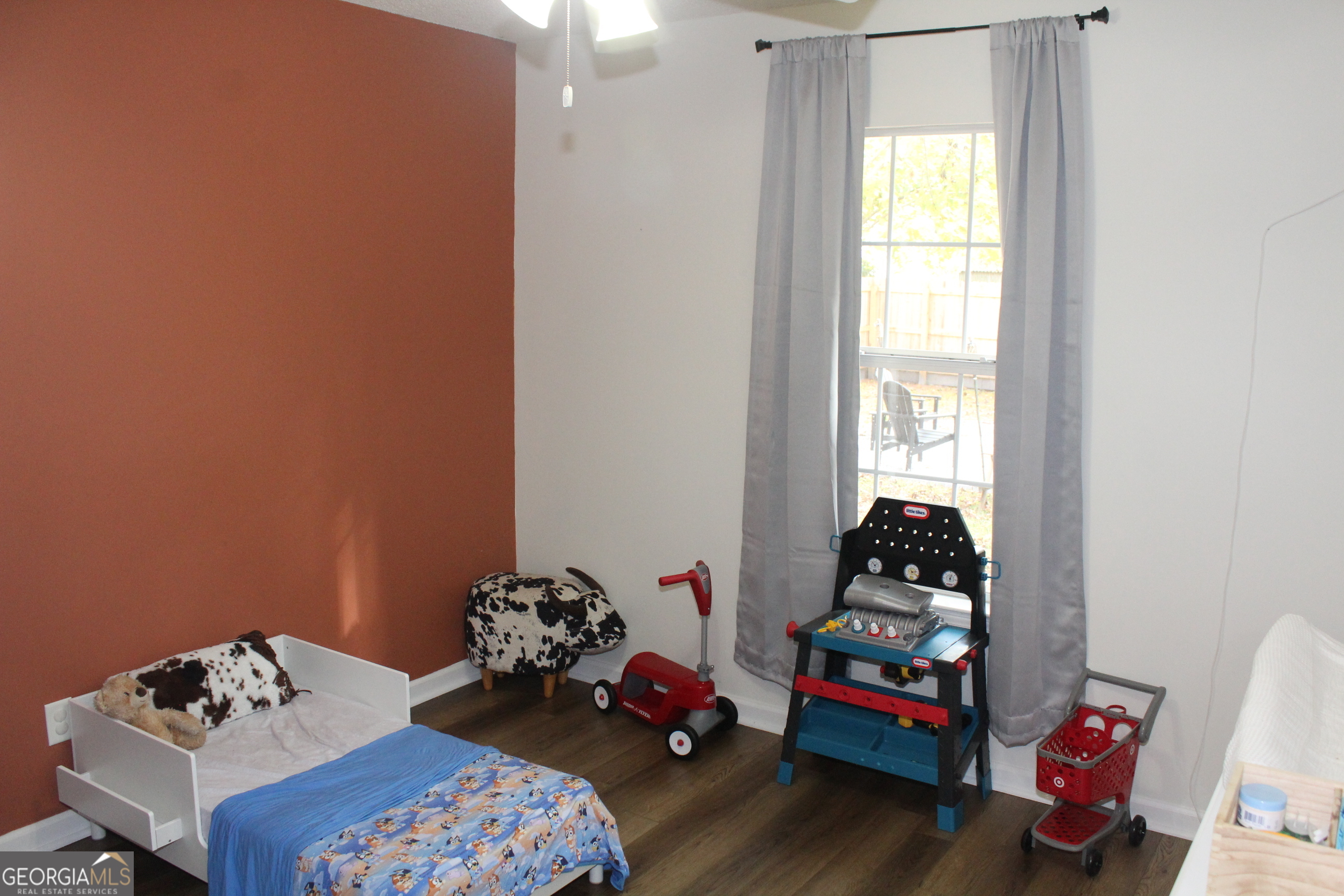 824 East Hilton Avenue Kingsland, GA 31548 - Photo 14 of 20 a bedroom with a bed and a window