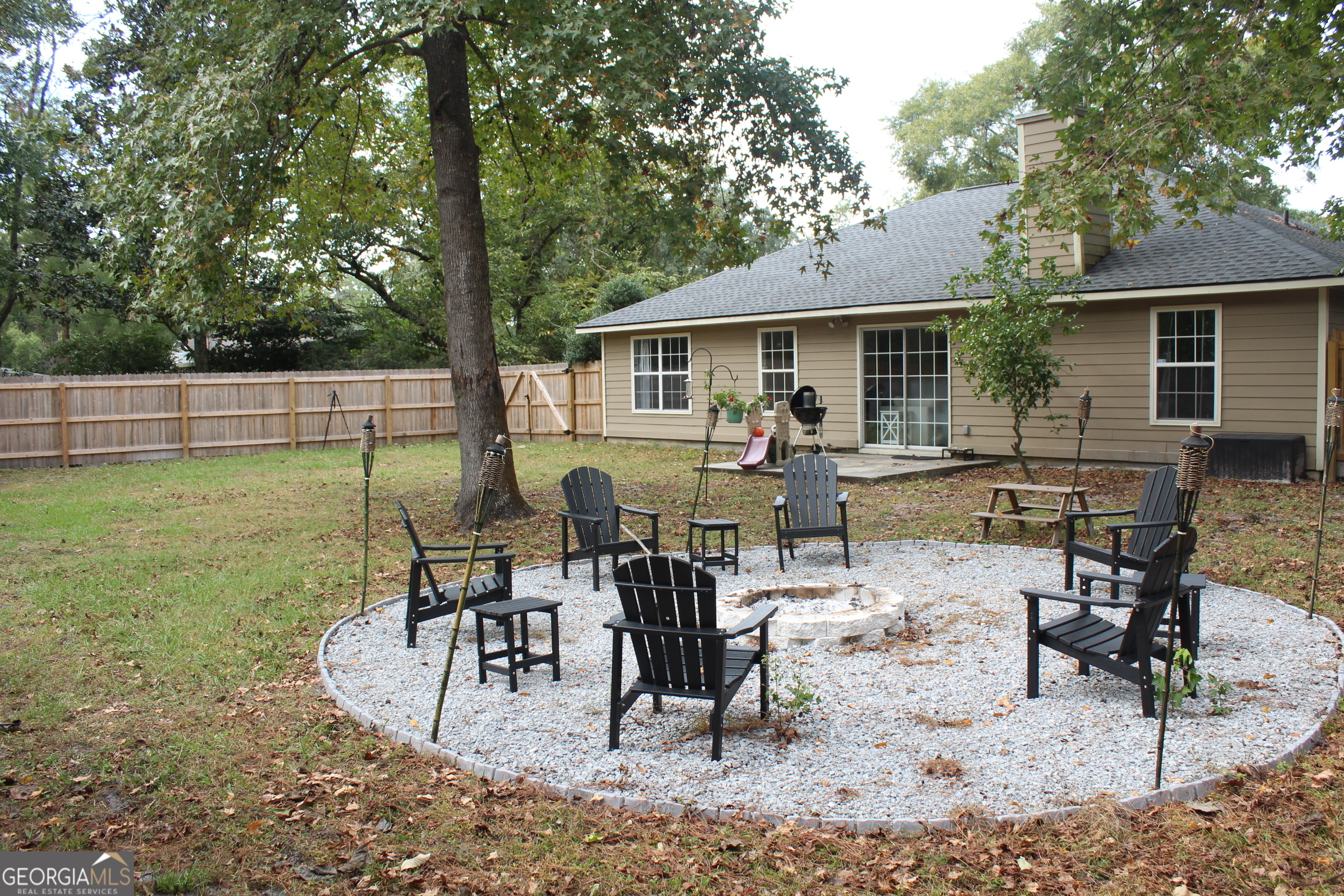 824 East Hilton Avenue Kingsland, GA 31548 - Photo 19 of 20 a view of a house with backyard sitting area and garden