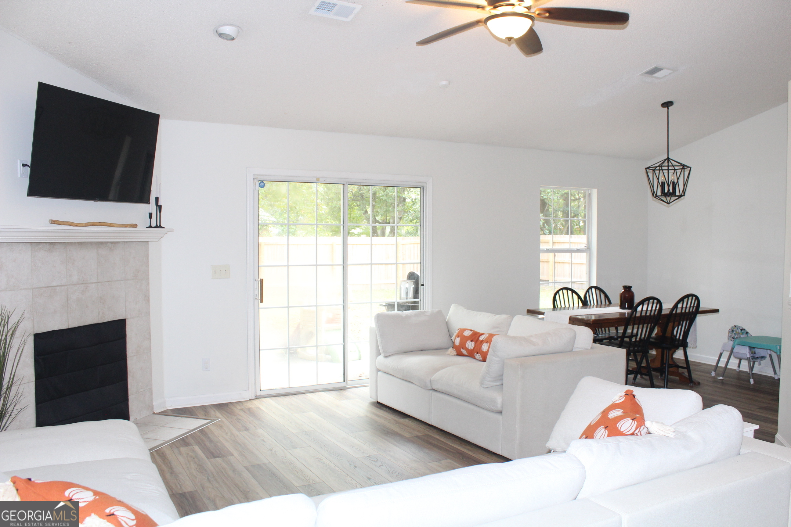 824 East Hilton Avenue Kingsland, GA 31548 - Photo 8 of 20 a living room with furniture fireplace and flat screen tv