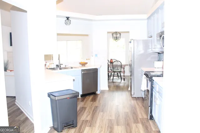 a kitchen with a stove and a microwave