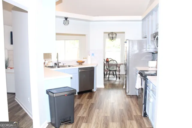 a kitchen with a stove and a microwave