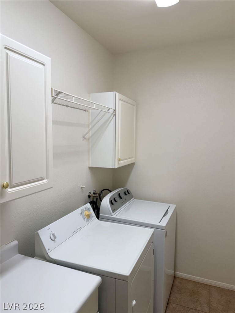 2050 West Warm Springs Road, Unit 3521 Henderson, NV 89014 - Photo 4 of 12 Functional laundry space featuring convenient shelving and essential appliances for everyday chores.