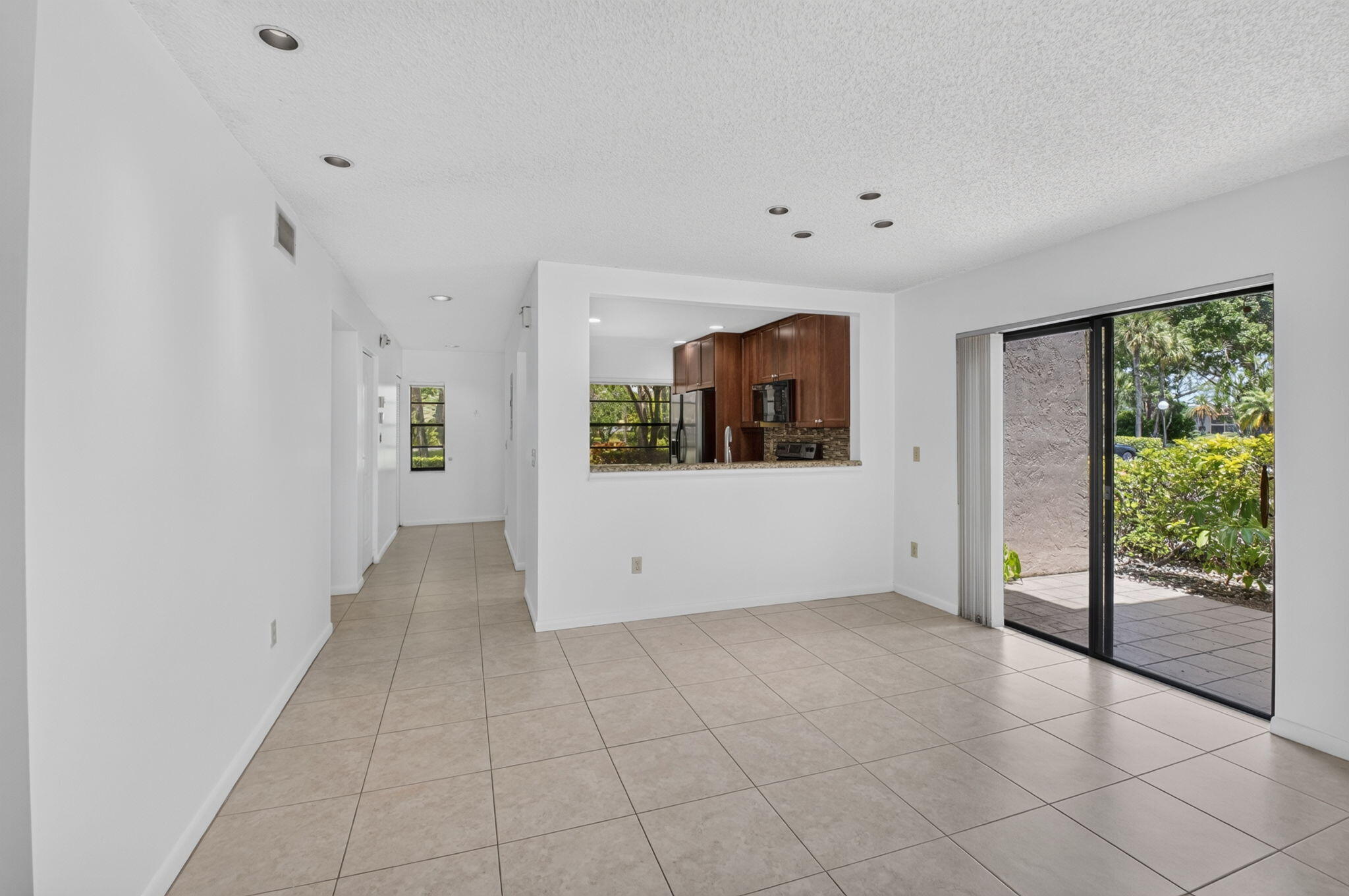 9264 Vista Del Lago, Unit A Boca Raton, FL 33428 - Photo 9 of 48 Living Room/Kitchen
