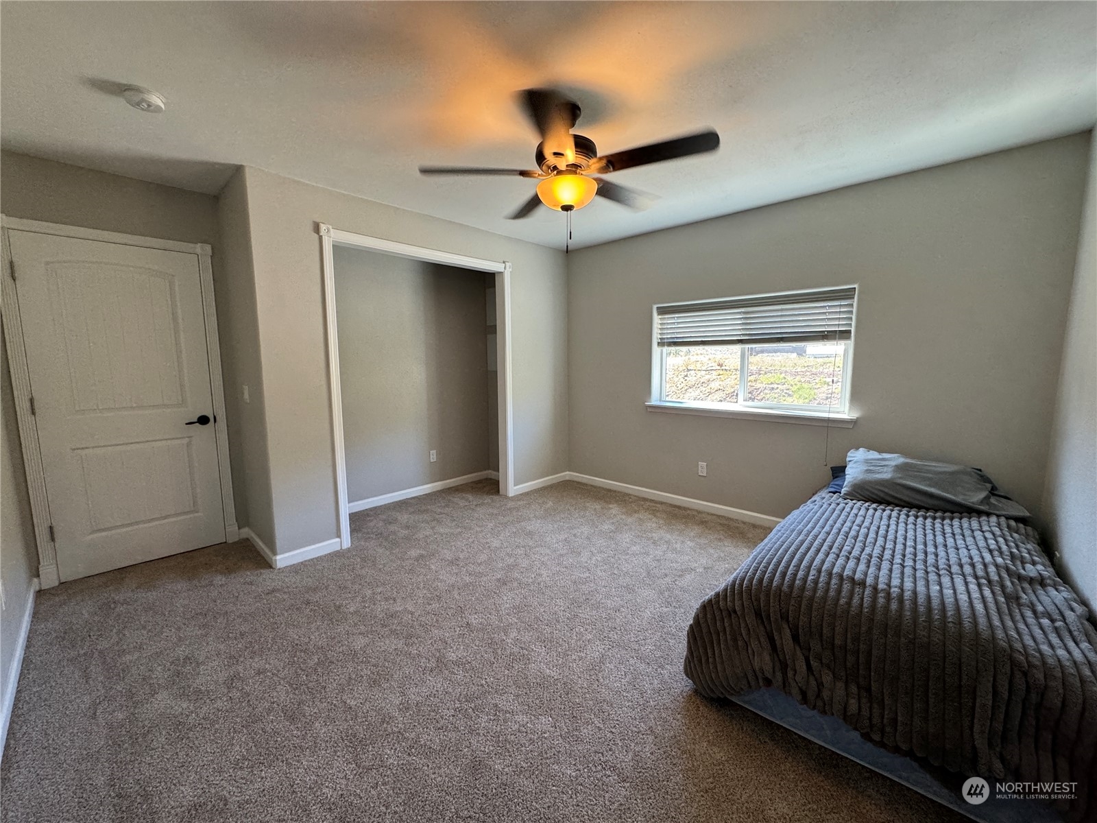 4 Eighme Road Oroville, WA 98844 - Photo 14 of 40 a bedroom with a bed and a chandelier