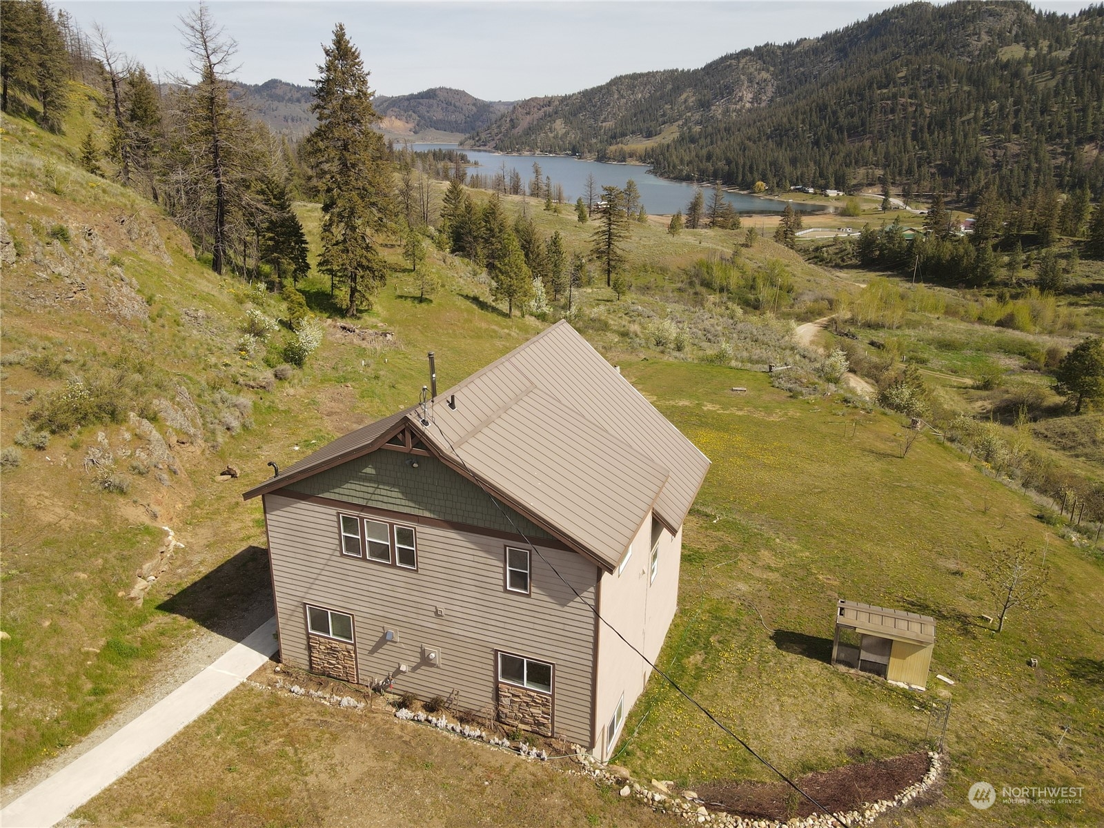 4 Eighme Road Oroville, WA 98844 - Photo 2 of 40 a view of a house with a mountain