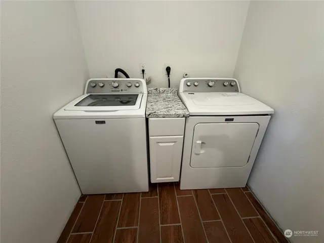 a utility room with dryer and washer