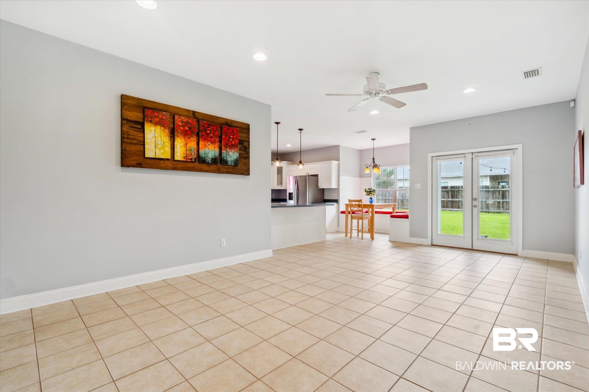 17297 Tallasee Boulevard Foley, AL 36535 - Photo 3 of 24 Unfurnished living room with light tile patterned flooring, french doors, and ceiling fan