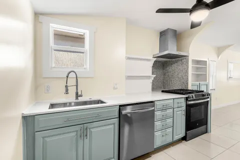 a kitchen with a stove and a sink