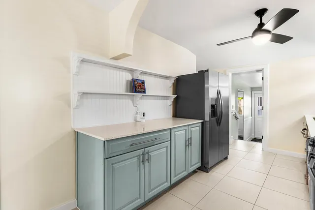 a kitchen with a sink cabinets and stainless steel appliances