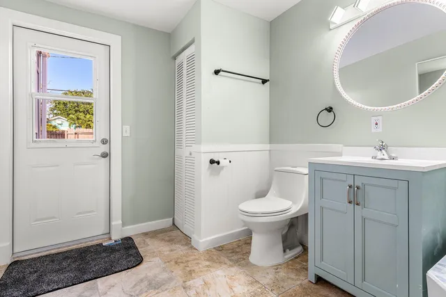 a bathroom with a sink toilet and vanity