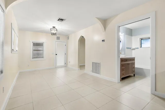 a view of a kitchen with cabinet and bathroom