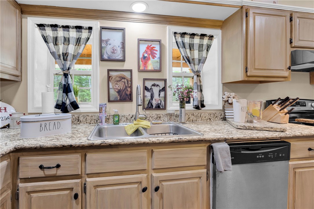 3030 Smith McGee Road Iva, SC 29655 - Photo 23 of 46 Granite counters and stainless steel appliances create a functional and pleasant kitchen space.