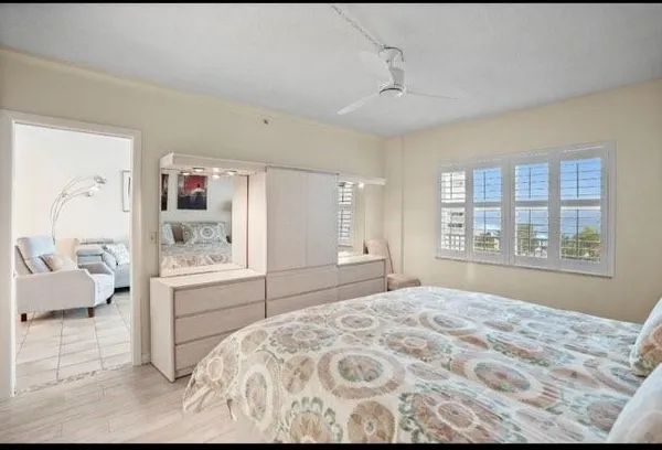 a bedroom with a large bed and a window