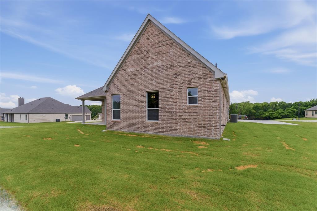 906 Perrin Lane Van Alstyne, TX 75495 - Photo 27 of 30 a view of a house with a yard