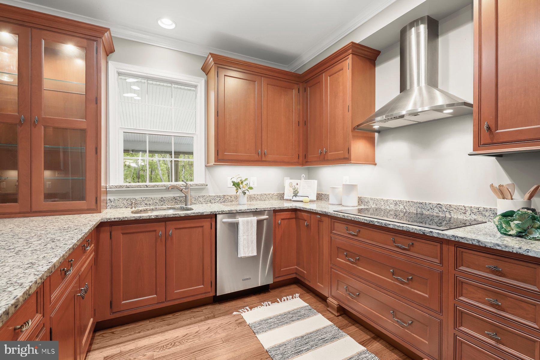 15101 Union Chapel Road Woodbine, MD 21797 - Photo 21 of 93 a kitchen with stainless steel appliances granite countertop wooden cabinets a sink and a window
