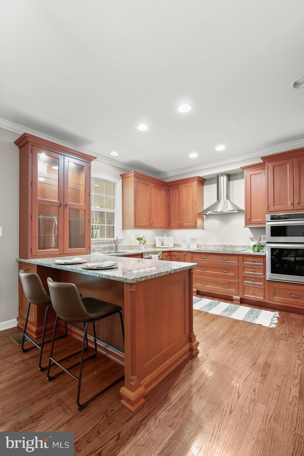 15101 Union Chapel Road Woodbine, MD 21797 - Photo 23 of 93 a kitchen with stainless steel appliances granite countertop a stove a sink and a microwave