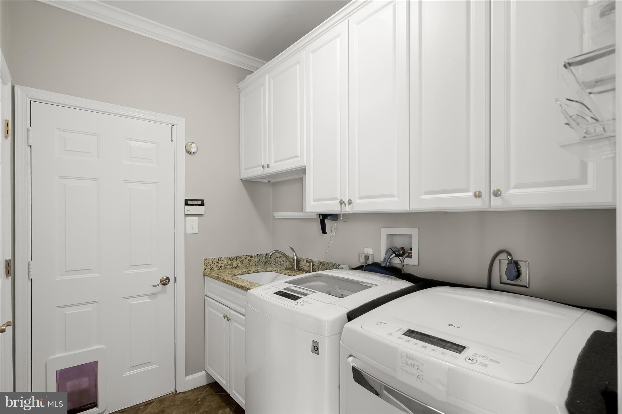 15101 Union Chapel Road Woodbine, MD 21797 - Photo 27 of 95 Main level laundry room w/ garage access