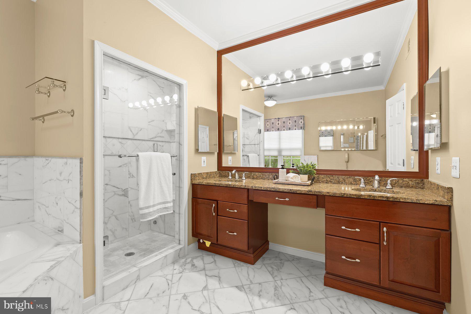 15101 Union Chapel Road Woodbine, MD 21797 - Photo 33 of 93 a spacious bathroom with a granite countertop sink mirror and bathtub