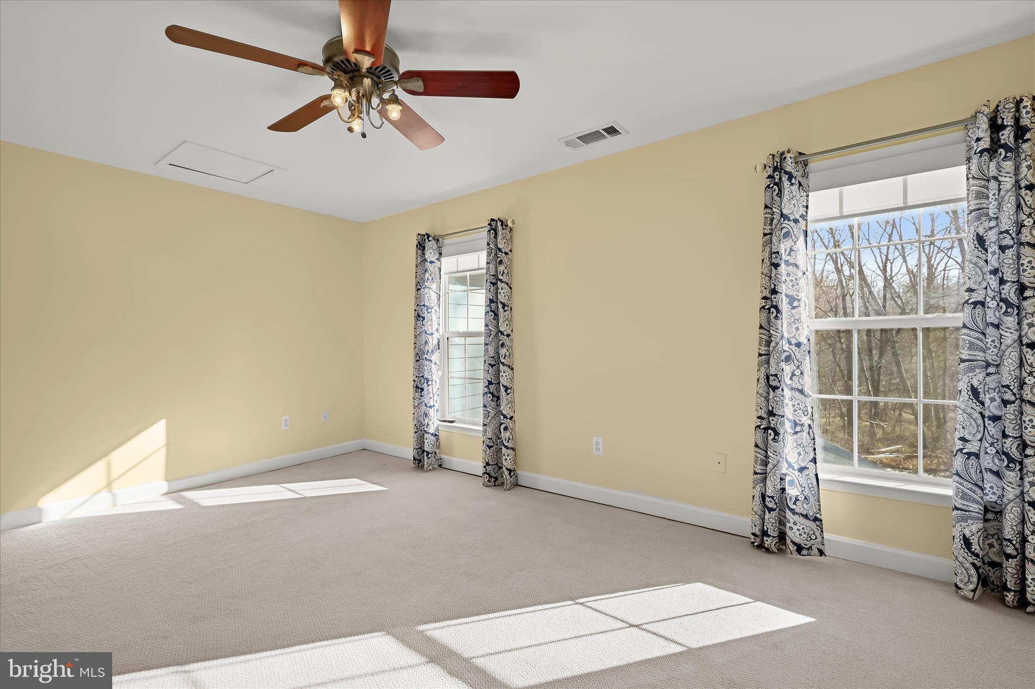 15101 Union Chapel Road Woodbine, MD 21797 - Photo 50 of 93 a view of livingroom with hardwood floor and a ceiling fan