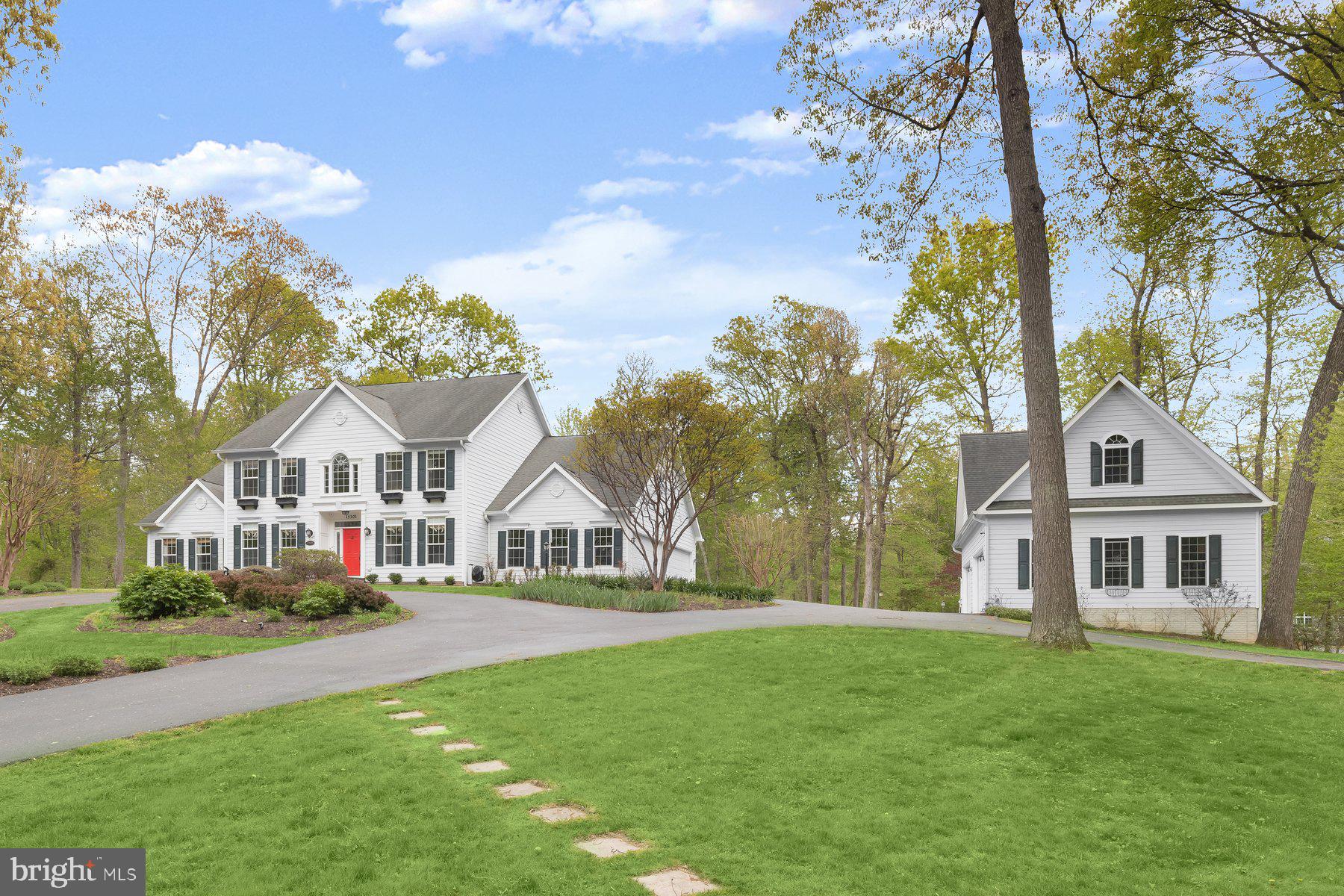 15101 Union Chapel Road Woodbine, MD 21797 - Photo 70 of 93 a front view of a house with a yard and trees