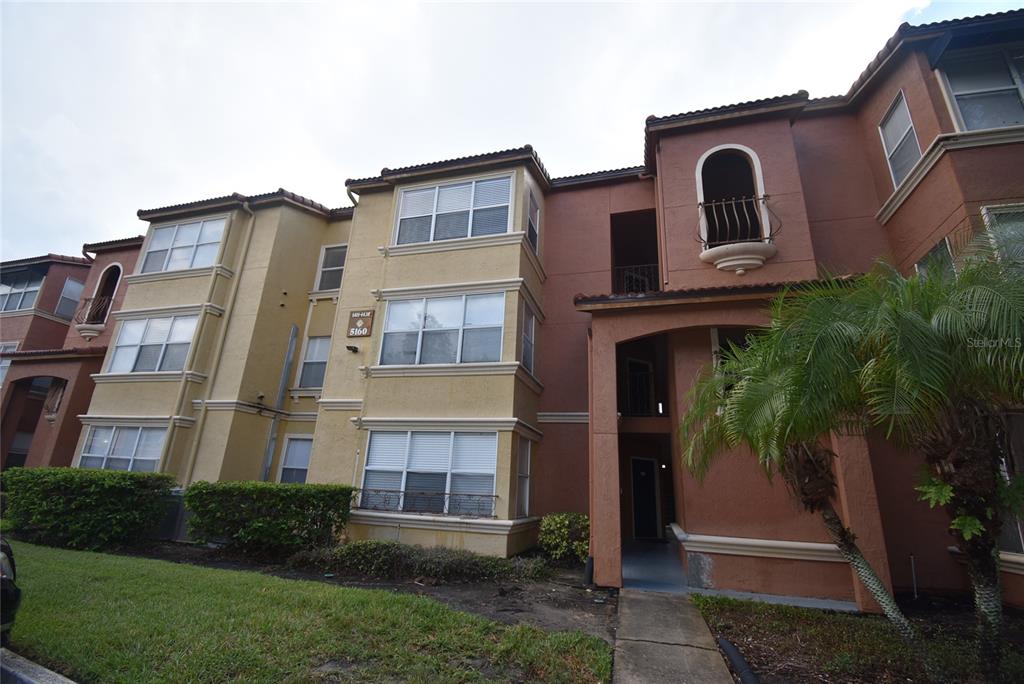 5160 Conroy Road, Unit 1435 Orlando, FL 32811 - Photo 1 of 18 a view of a building with a yard