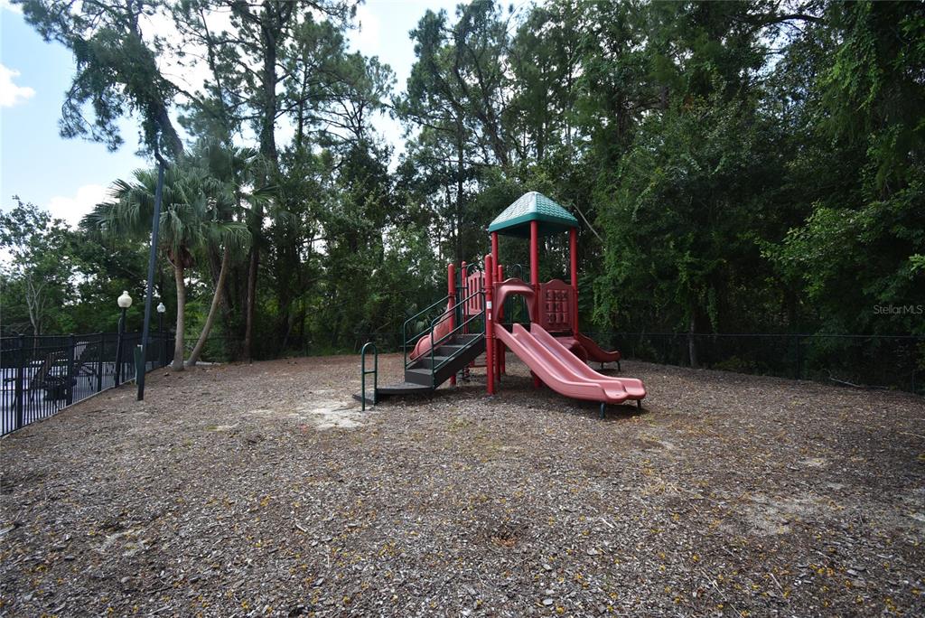 5160 Conroy Road, Unit 1435 Orlando, FL 32811 - Photo 18 of 18 a view of outdoor space with playground and green space