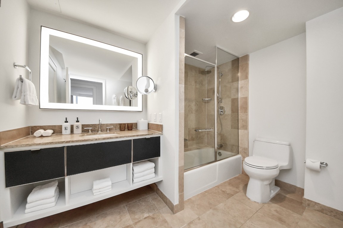 1300 Lamar Street, Unit T3 Houston, TX 77010 - Photo 28 of 49 a bathroom with a sink and a mirror