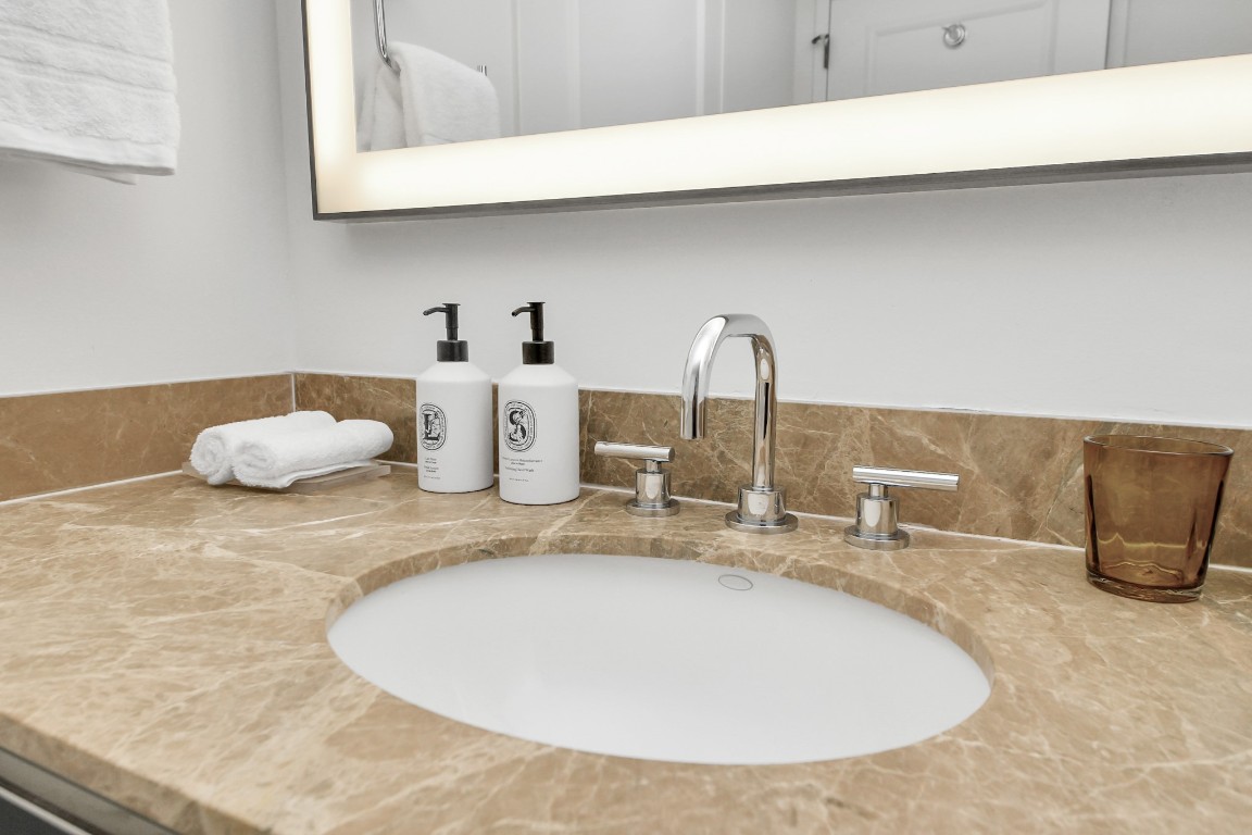 1300 Lamar Street, Unit T3 Houston, TX 77010 - Photo 30 of 49 a bathroom with a sink and a mirror