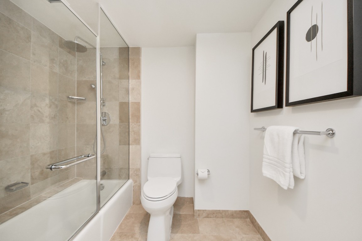 1300 Lamar Street, Unit T3 Houston, TX 77010 - Photo 31 of 49 a bathroom with a toilet and a shower