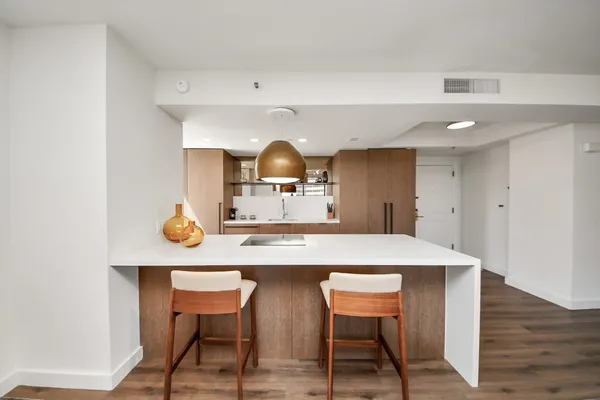 a kitchen with a table and chairs in it