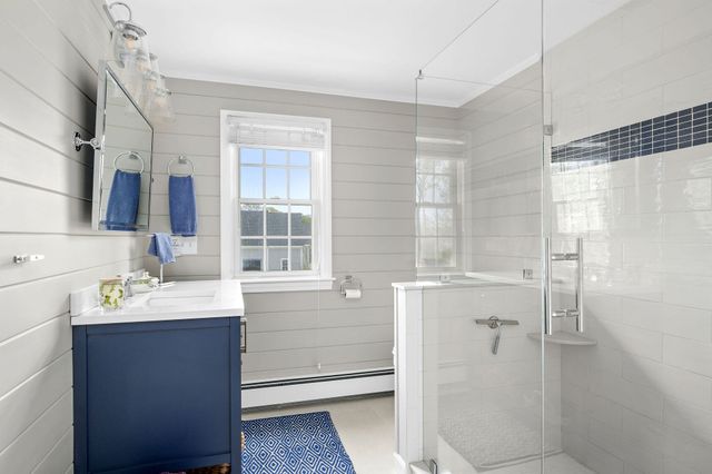 a bathroom with a sink double vanity and shower