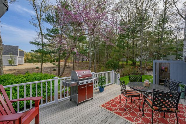 a view of a deck with furniture