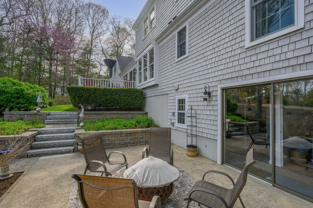 a backyard of a house with seating space