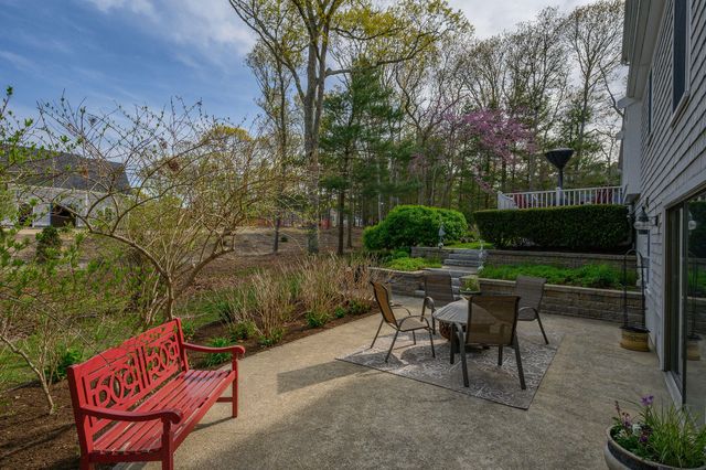 a backyard of a house with outdoor seating