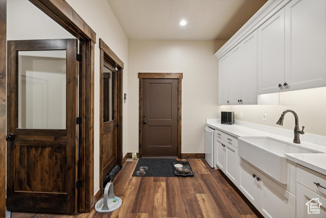 6117 North Rocky Ridge Road Peoa, UT 84061 - Photo 55 of 83 Laundry room featuring dark wood-type flooring and sink