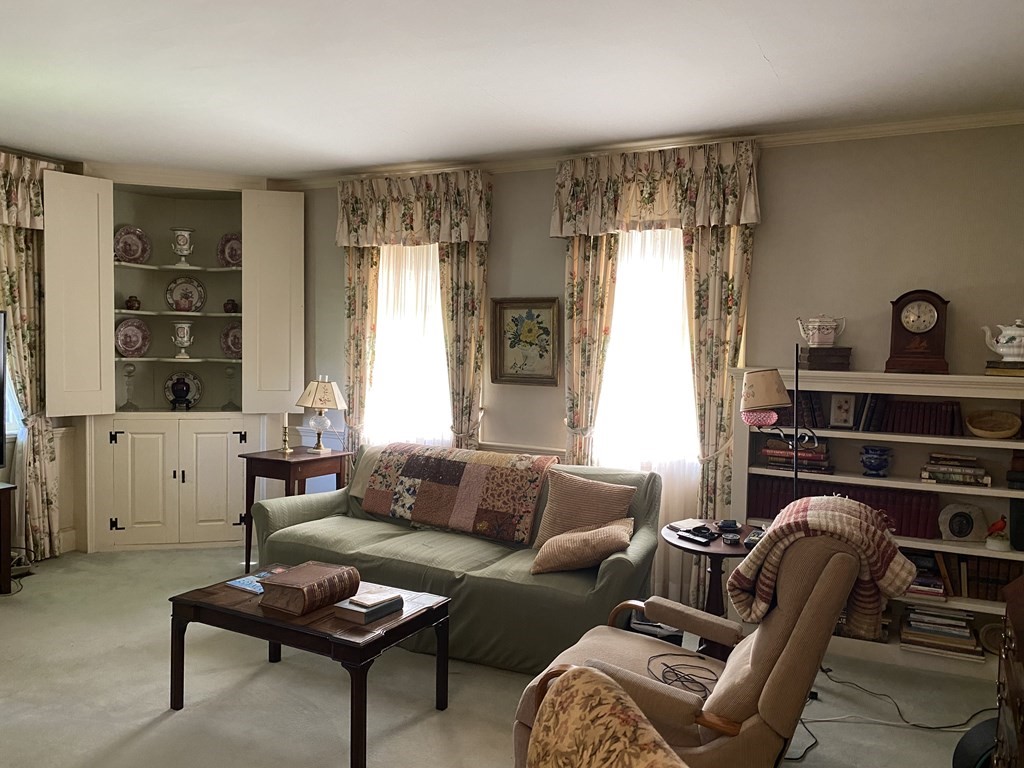100 Brattleboro Road Bernardston, MA 01337 - Photo 13 of 42 a living room with furniture a lamp and a window