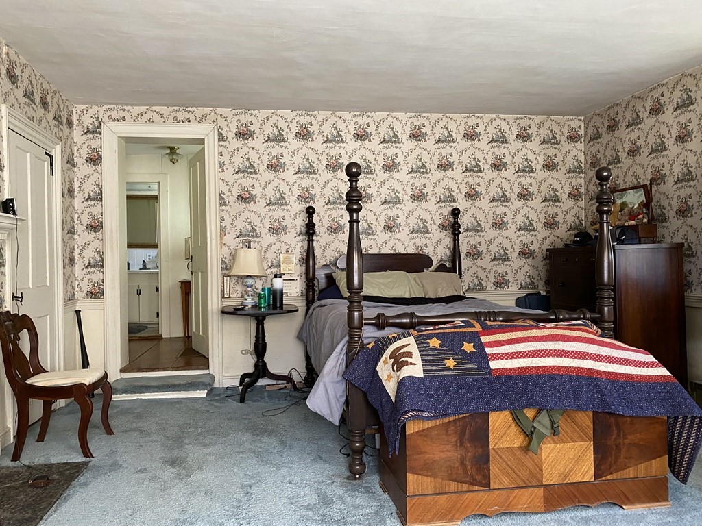 100 Brattleboro Road Bernardston, MA 01337 - Photo 17 of 42 a bedroom with a bed and a couch