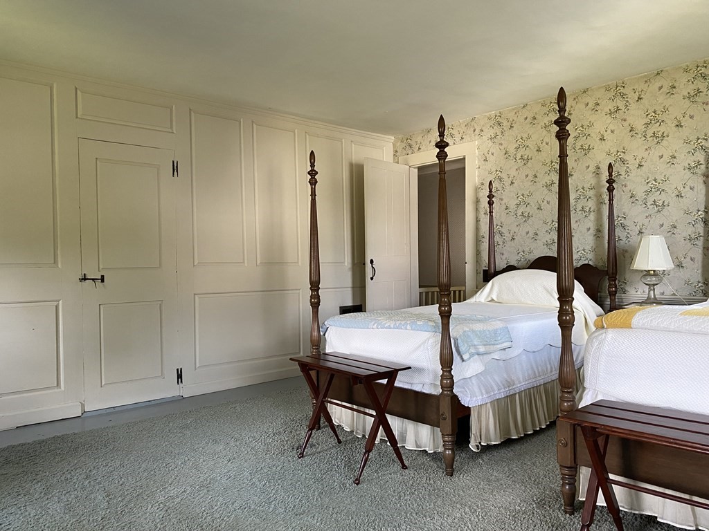 100 Brattleboro Road Bernardston, MA 01337 - Photo 21 of 42 a bedroom with a bed table and chair