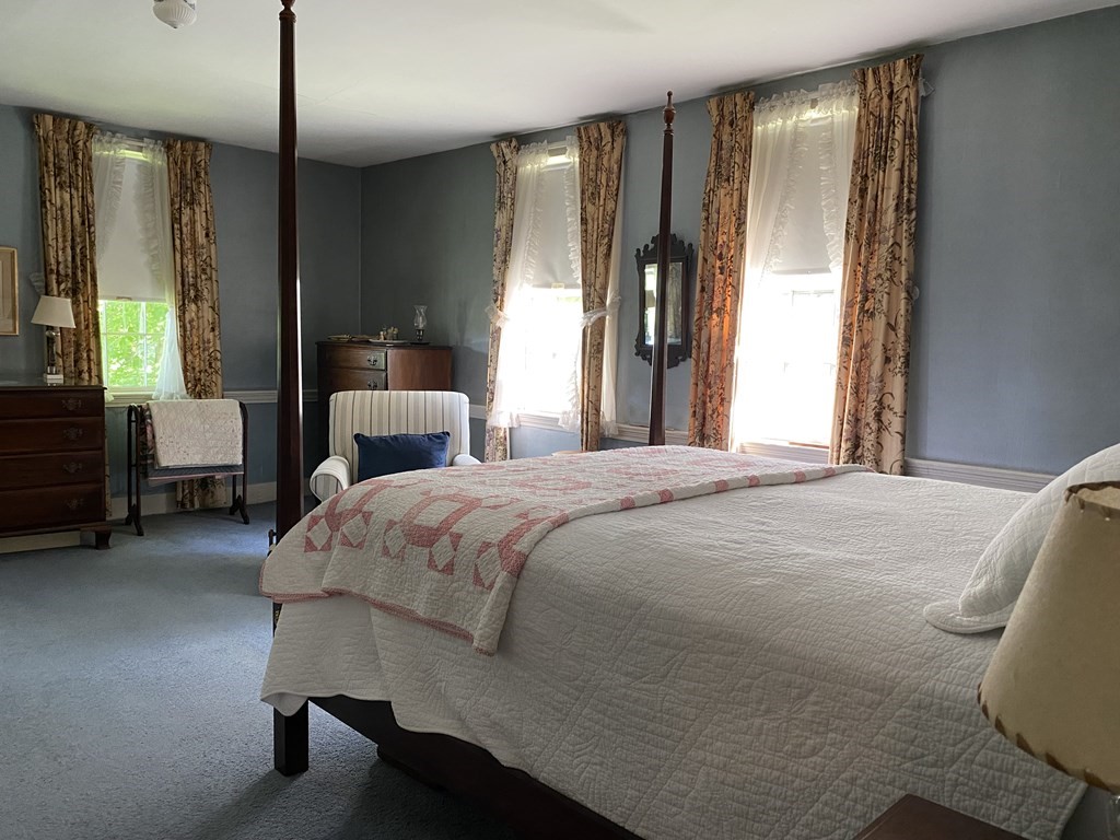 100 Brattleboro Road Bernardston, MA 01337 - Photo 24 of 42 a bedroom with a bed lamps and window