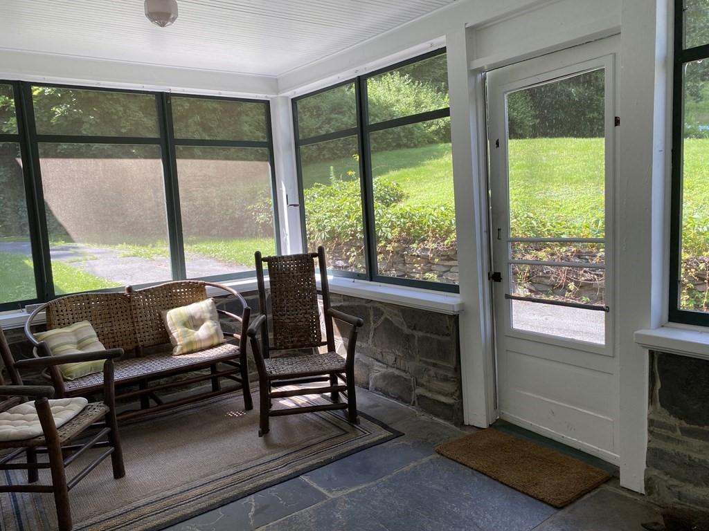 100 Brattleboro Road Bernardston, MA 01337 - Photo 6 of 42 a living room with furniture and a floor to ceiling window