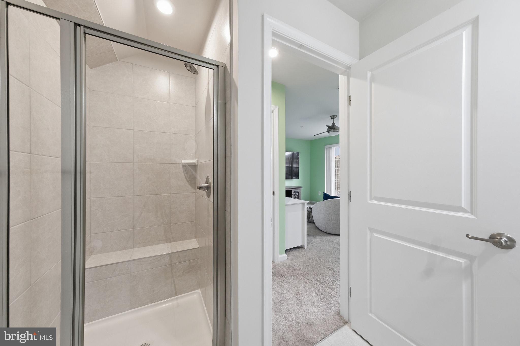 3012 Bretons Ridge Way Hanover, MD 21076 - Photo 34 of 37 a bathroom with a glass shower door