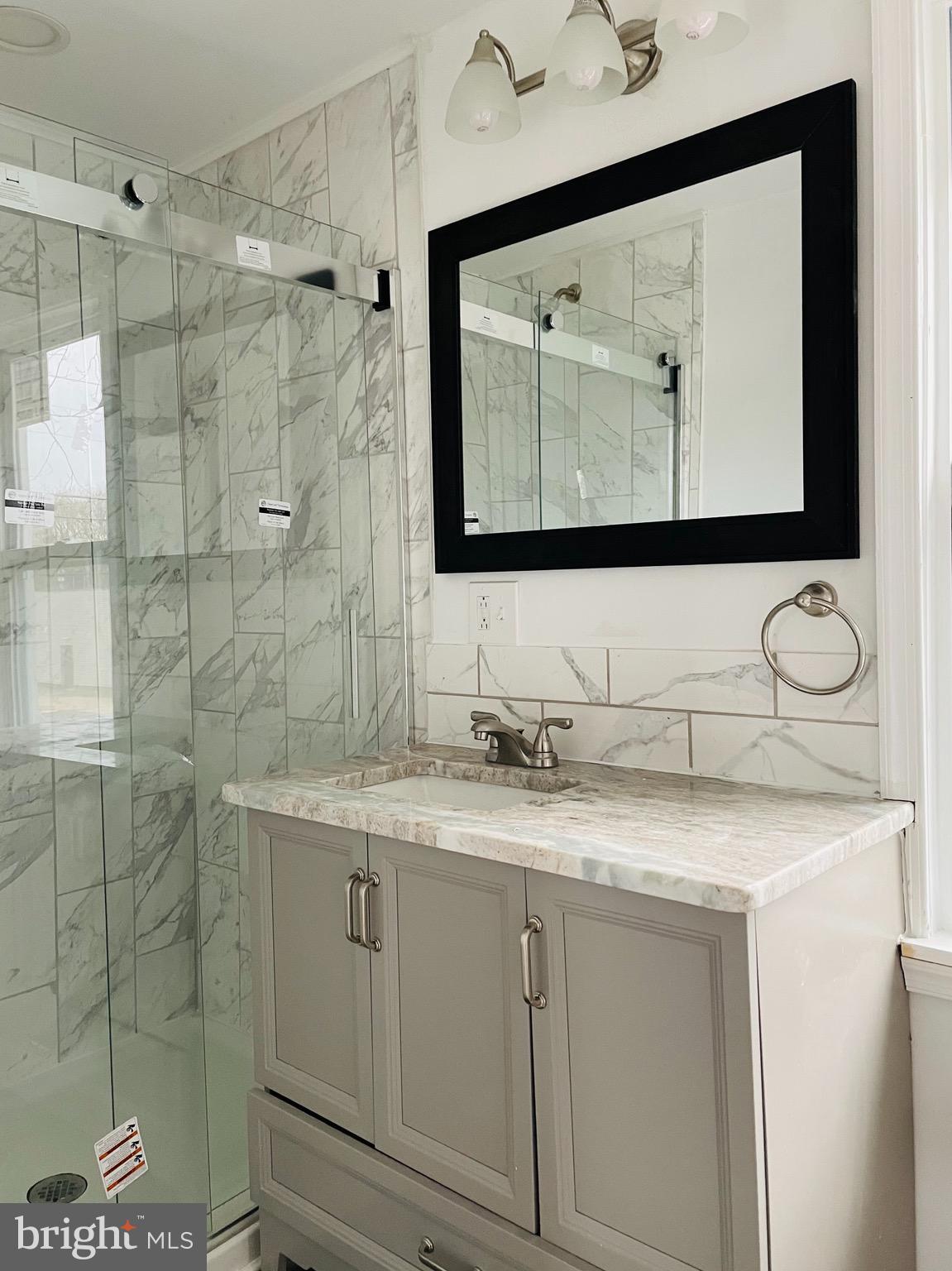 301 Erial Road Pine Hill, NJ 08021 - Photo 5 of 8 a bathroom with a granite countertop sink mirror and