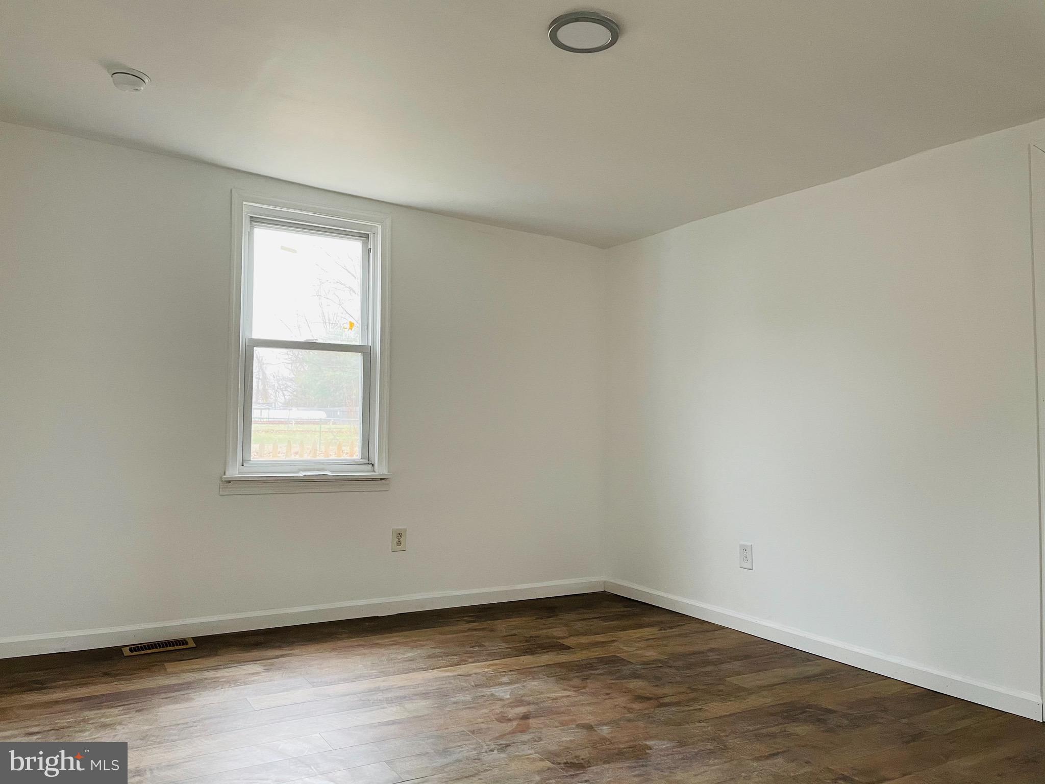 301 Erial Road Pine Hill, NJ 08021 - Photo 6 of 8 an empty room with a window