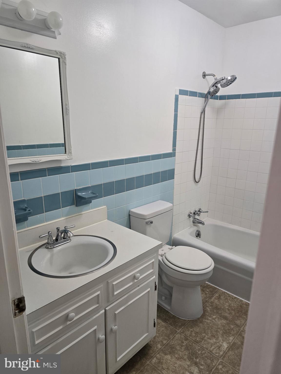 439 Ridgemore Street Fredericksburg, VA 22405 - Photo 15 of 17 a bathroom with a sink toilet a mirror and shower