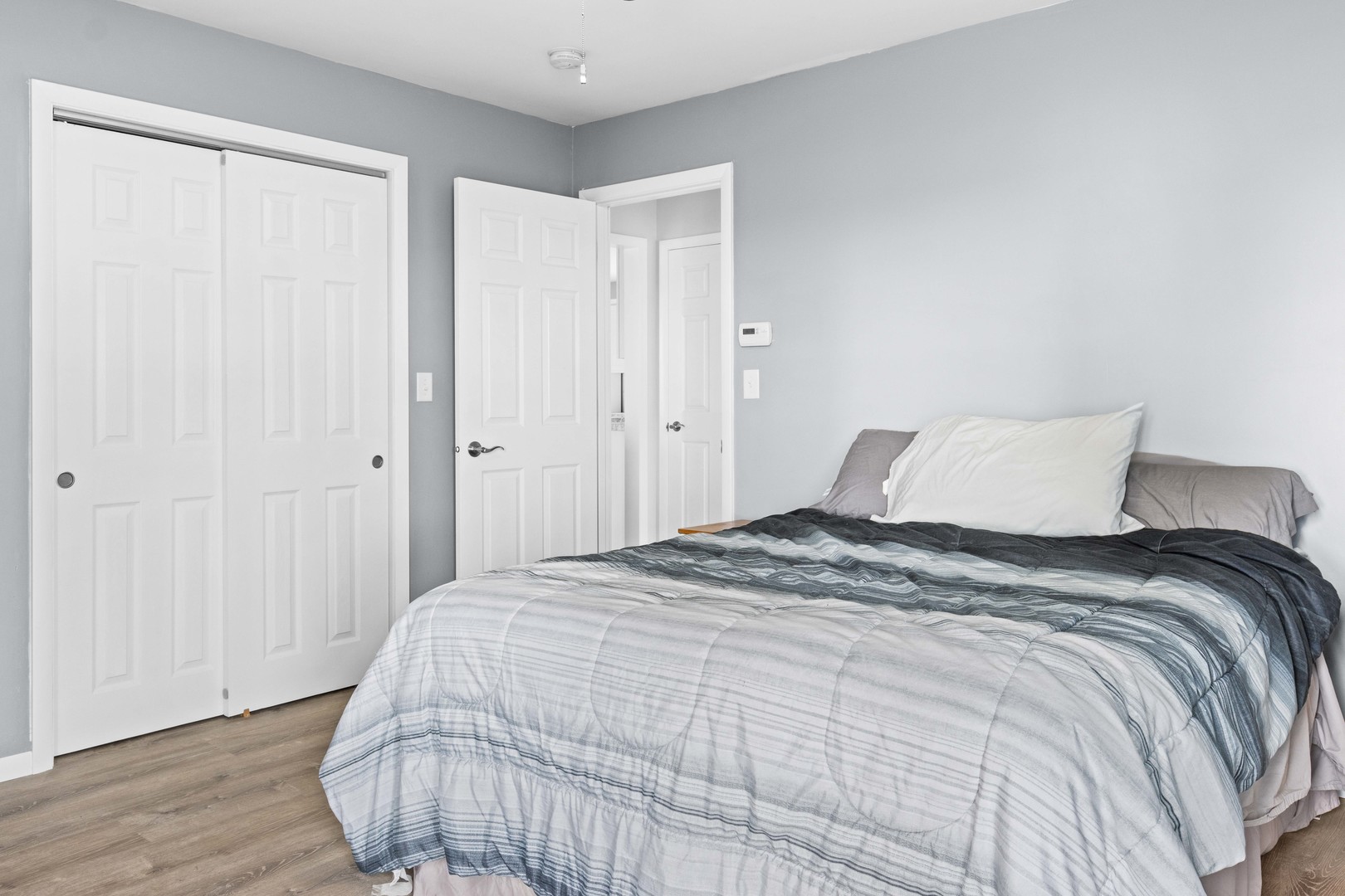 1579 West 2000S Road Kankakee, IL 60901 - Photo 16 of 24 a bedroom with a bed and wooden floor