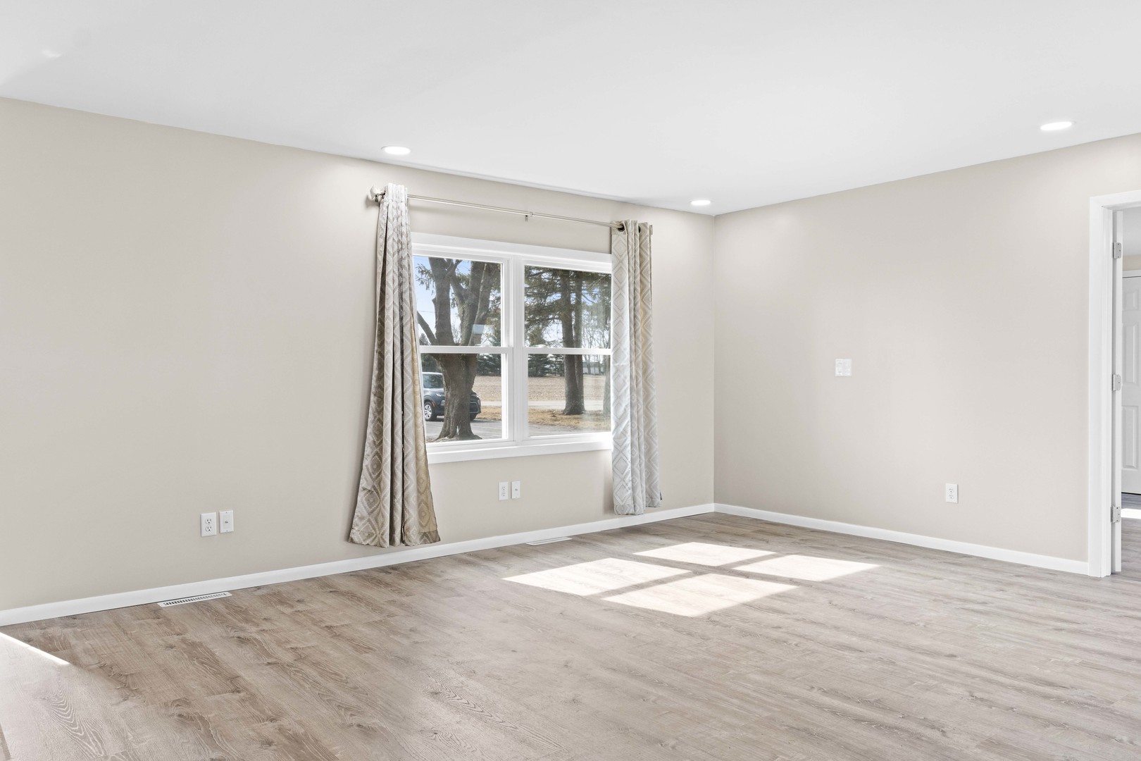 1579 West 2000S Road Kankakee, IL 60901 - Photo 20 of 24 an empty room with wooden floor and windows