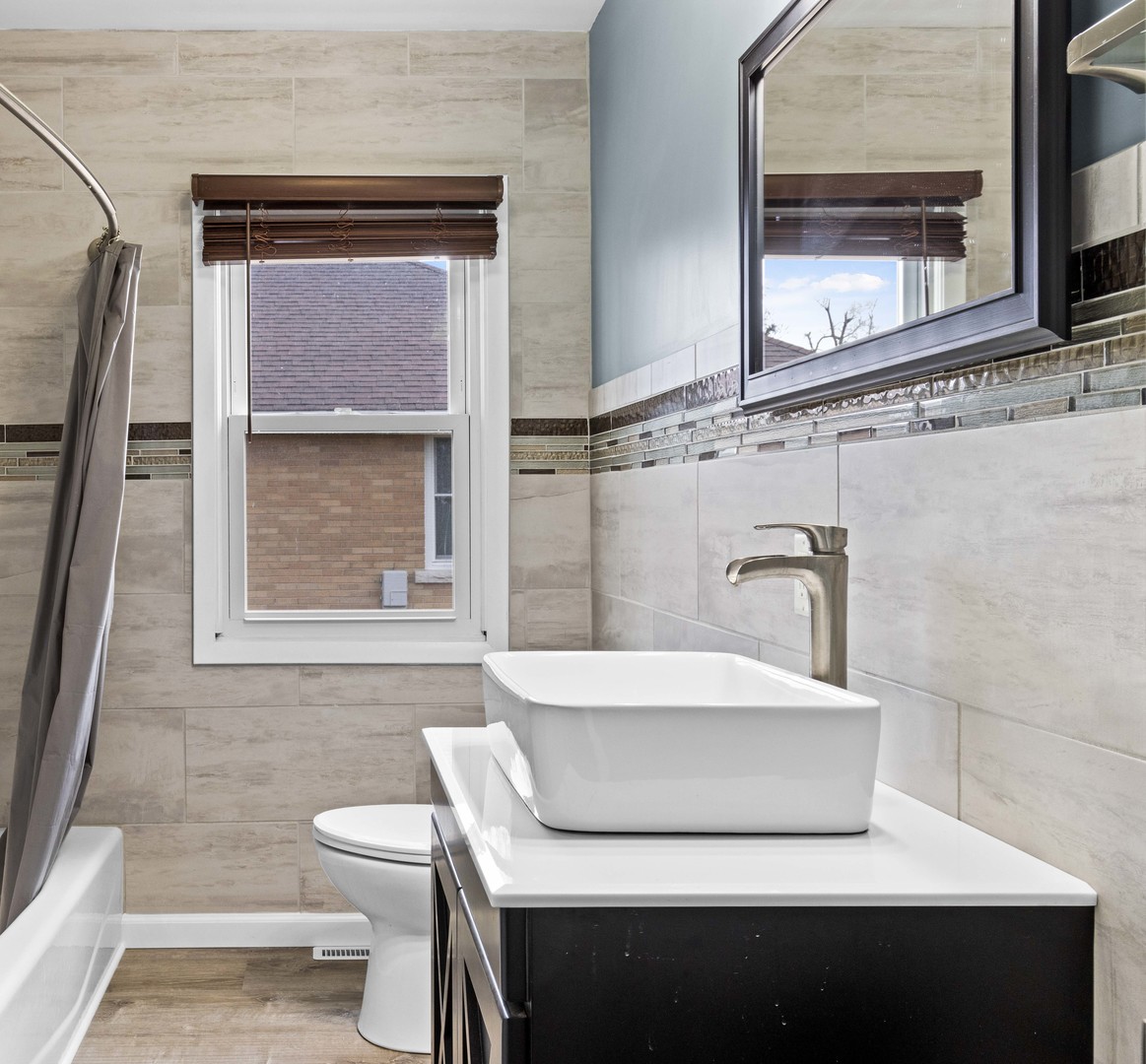 1579 West 2000S Road Kankakee, IL 60901 - Photo 10 of 24 a bathroom with a sink and a toilet